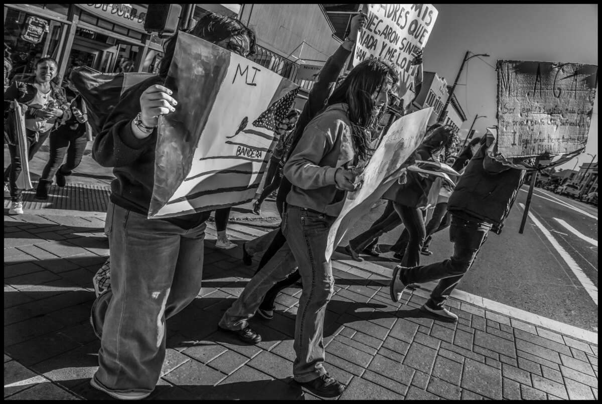 These photos capture protests against ICE and Trump’s threats of mass deportation in February 2025, in San Mateo and Fort Bragg, California.