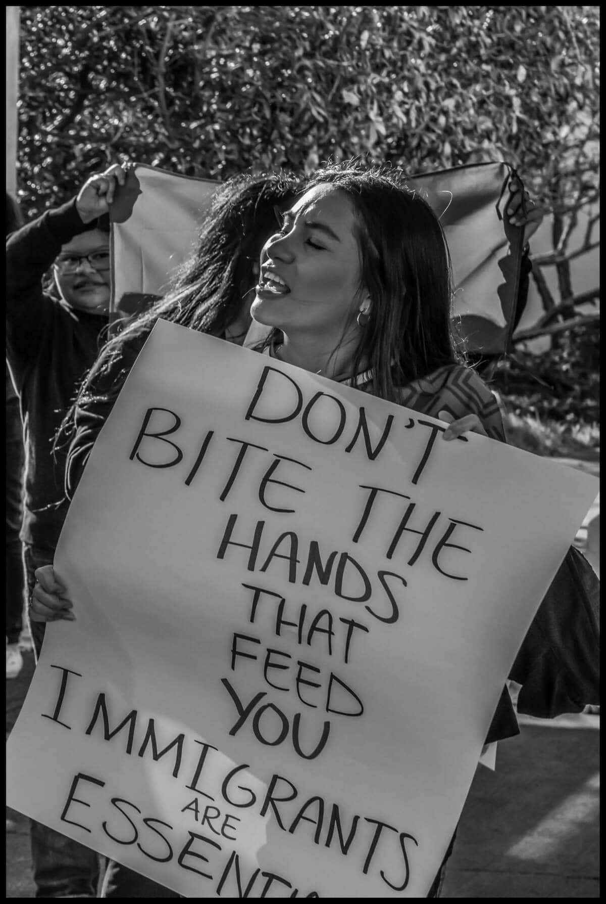 These photos capture protests against ICE and Trump’s threats of mass deportation in February 2025, in San Mateo and Fort Bragg, California.