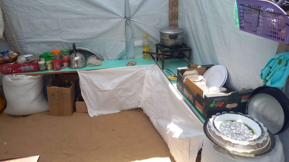 Having been displacement by the genocide, Gaza chef Mona Zahed now cooks in this small kitchen in a tent made of nylon. This photo is from January 2024.